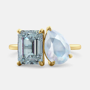 Toi et Moi ring with an emerald-cut Sky Blue Topaz and a pear-cut Moonstone.