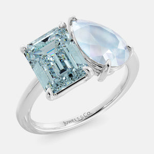 Toi et Moi ring with an emerald-cut Sky Blue Topaz and a pear-cut Moonstone.
