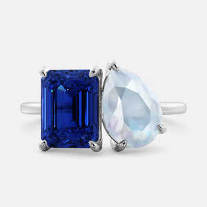 Toi et Moi ring with an emerald-cut Blue Sapphire and a pear-cut Moonstone.