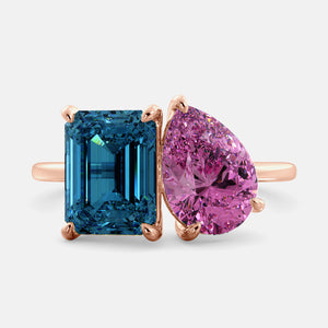 Toi et Moi ring with an emerald-cut London Blue Topaz and a pear-cut Pink Sapphire.