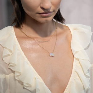 Toi et Moi necklace with an emerald-cut Diamond and a pear-cut gemstone.