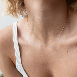 Toi et Moi necklace with an emerald-cut Diamond and a pear-cut gemstone.