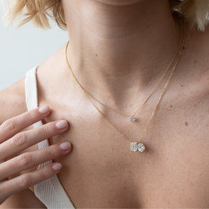 Toi et Moi necklace with an emerald-cut Diamond and a pear-cut gemstone.