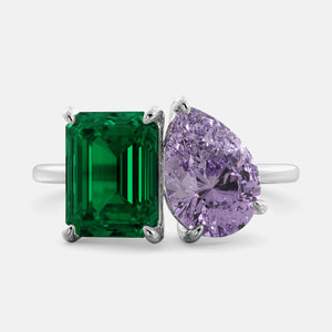 Toi et Moi ring with an emerald-cut Emerald and a pear-cut Amethyst.