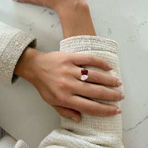 Toi et Moi ring with an emerald-cut Ruby and a pear-cut Diamond.