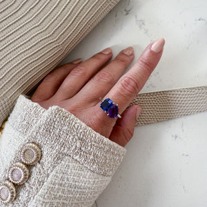 Toi et Moi ring with an emerald-cut Blue Sapphire and a pear-cut Amethyst.