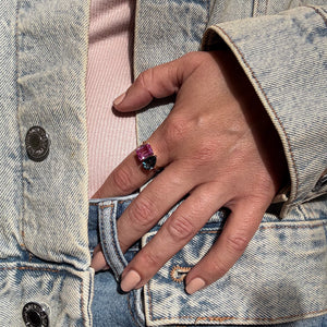 Toi et Moi ring with an emerald-cut Pink Sapphire and a pear-cut London Blue Topaz.