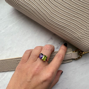 Toi et Moi ring with an emerald-cut Green Peridot and a pear-cut Amethyst.