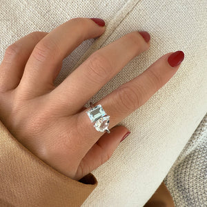 Toi et Moi ring with an emerald-cut Aquamarine and a pear-cut Diamond.