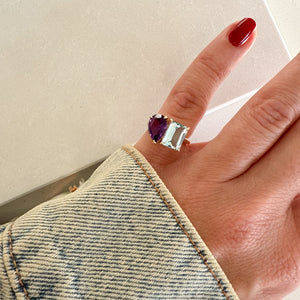 Toi et Moi ring with an emerald-cut Aquamarine and a pear-cut Amethyst.