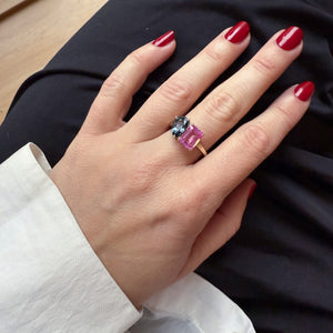 Toi et Moi ring with an emerald-cut Pink Sapphire and a pear-cut London Blue Topaz.