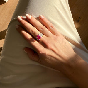 Toi et Moi ring with an emerald-cut Pink Sapphire and a pear-cut Moonstone.