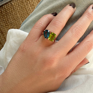 Toi et Moi ring with an emerald-cut Green Peridot and a pear-cut London Blue Topaz.