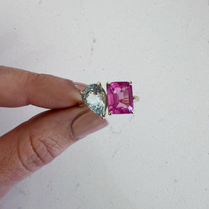 Toi et Moi ring with an emerald-cut Pink Sapphire and a pear-cut Aquamarine.