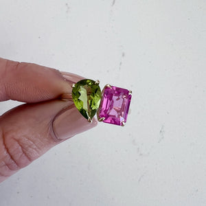 Toi et Moi ring with an emerald-cut Pink Sapphire and a pear-cut Green Peridot.
