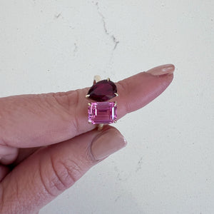 Toi et Moi ring with an emerald-cut Pink Sapphire and a pear-cut Ruby.