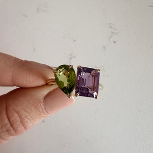 Toi et Moi ring with an emerald-cut Amethyst and a pear-cut Green Peridot.