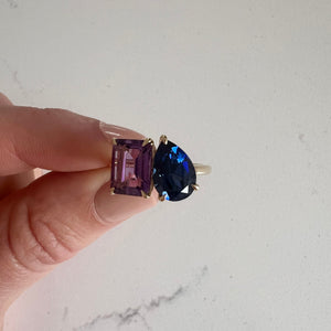 Toi et Moi ring with an emerald-cut Amethyst and a pear-cut Blue Sapphire.