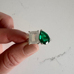 Toi et Moi ring with an emerald-cut Moonstone and a pear-cut Emerald.