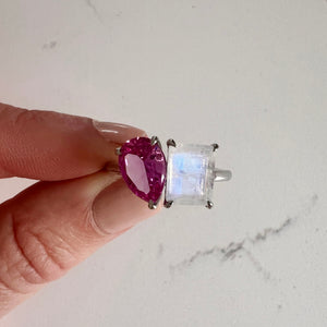 Toi et Moi ring with an emerald-cut Moonstone and a pear-cut Pink Sapphire.