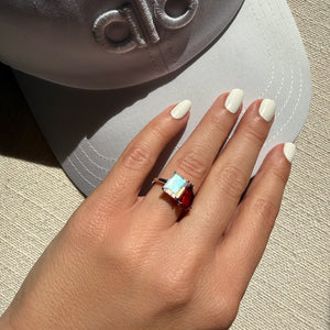 Toi et Moi ring with an emerald-cut Moonstone and a pear-cut Ruby.