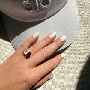 Toi et Moi ring with an emerald-cut Moonstone and a pear-cut Ruby.