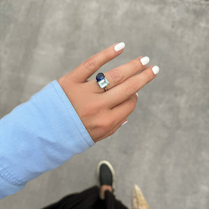 Toi et Moi ring with an emerald-cut Aquamarine and a pear-cut Blue Sapphire.