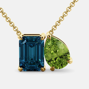 Toi et Moi necklace with an emerald-cut London Blue Topaz and a pear-cut gemstone.