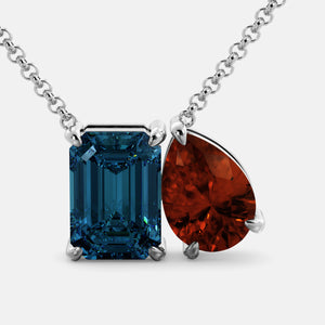 Toi et Moi necklace with an emerald-cut London Blue Topaz and a pear-cut gemstone.