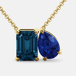 Toi et Moi necklace with an emerald-cut London Blue Topaz and a pear-cut gemstone.
