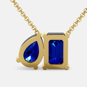 Toi et Moi necklace with an emerald-cut Blue Sapphire and a pear-cut gemstone.