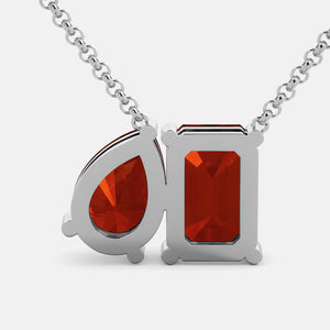 Toi et Moi necklace with an emerald-cut Garnet and a pear-cut gemstone.