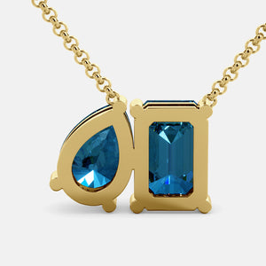 Toi et Moi necklace with an emerald-cut London Blue Topaz and a pear-cut gemstone.
