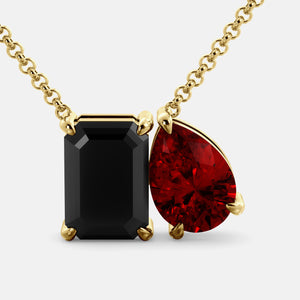 Toi et Moi necklace with an emerald-cut Onyx and a pear-cut gemstone.