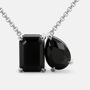 Toi et Moi necklace with an emerald-cut Onyx and a pear-cut gemstone.
