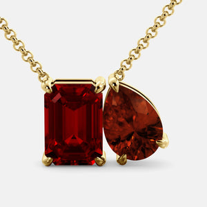 Toi et Moi necklace with an emerald-cut Ruby and a pear-cut gemstone.