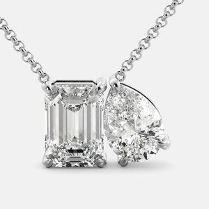 Toi et Moi necklace with an emerald-cut Diamond and a pear-cut gemstone.