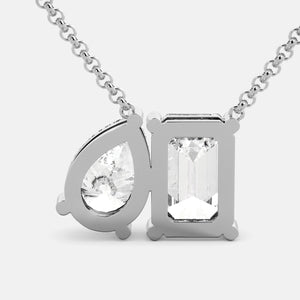 Toi et Moi necklace with an emerald-cut Diamond and a pear-cut gemstone.