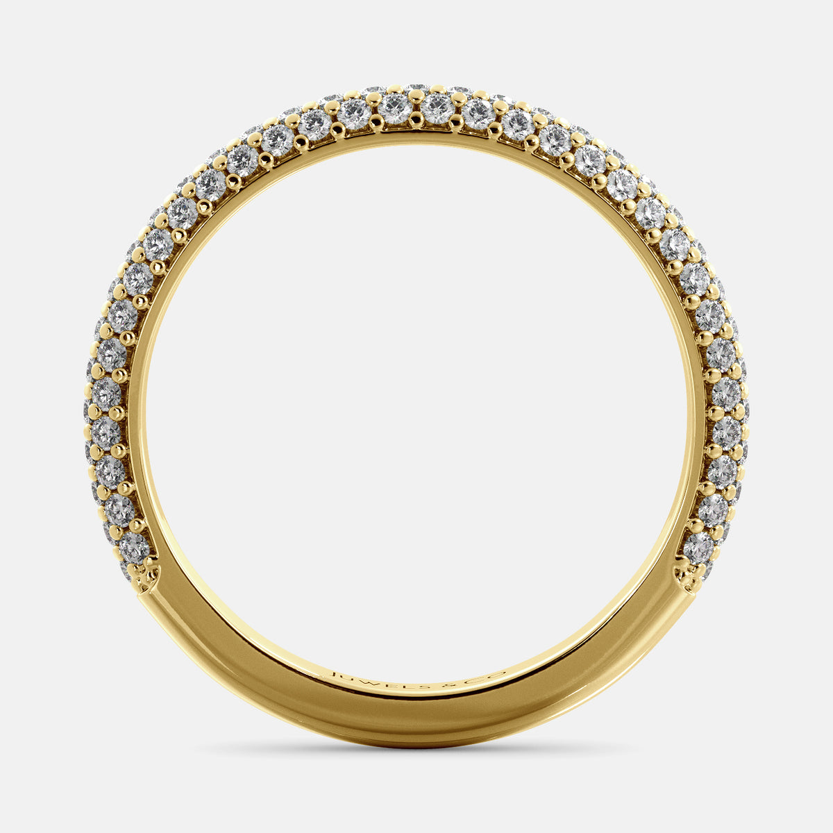 A close-up of a 3-row lab-grown diamond wedding band in 14K yellow gold. The band is set with round brilliant diamonds that sparkle and shine. The band is a beautiful and timeless choice for a wedding band.