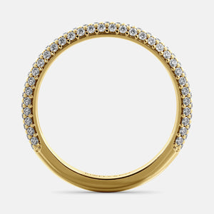 A close-up of a 3-row lab-grown diamond wedding band in 14K yellow gold. The band is set with round brilliant diamonds that sparkle and shine. The band is a beautiful and timeless choice for a wedding band.