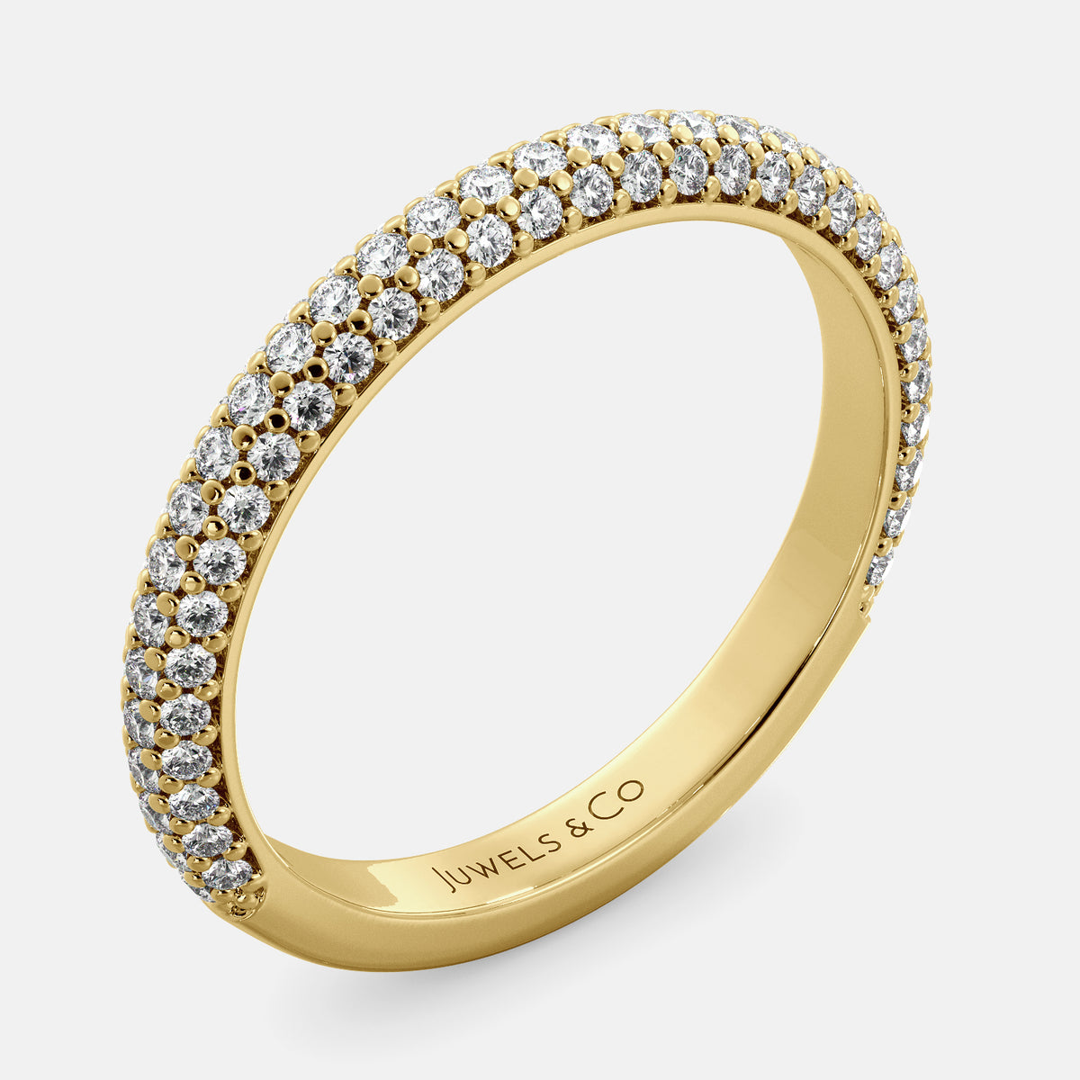 A close-up of a 3-row lab-grown diamond wedding band in 14K yellow gold. The band is set with round brilliant diamonds that sparkle and shine. The band is a beautiful and timeless choice for a wedding band.