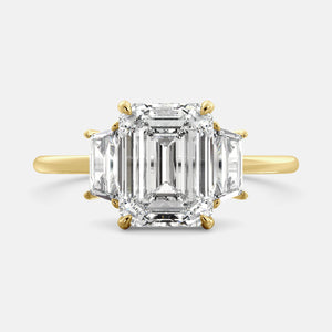 Embrace Opulence: The Julia Emerald Solitaire Diamond Ring with Tapered Baguettes