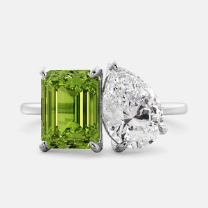 Toi et Moi ring with an emerald-cut Green Peridot and a pear-cut Diamond.