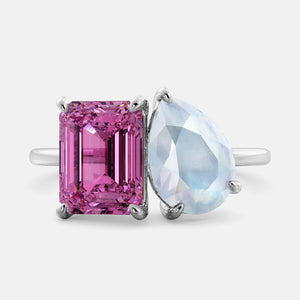 Toi et Moi ring with an emerald-cut Pink Sapphire and a pear-cut Moonstone.