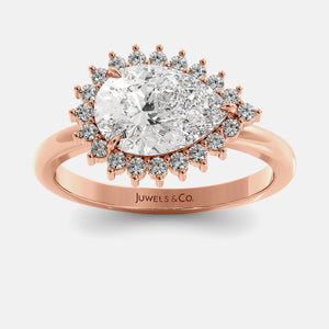 Rose gold ring with a large diamond and smaller diamonds on a white background, featuring the brand 'Juwels & Co'.