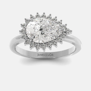 Diamond ring with a halo of smaller diamonds on a white background, branded 'Juwels & Co'.