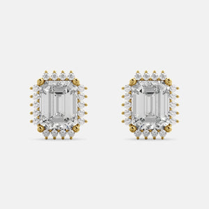 A pair of emerald-cut diamond earrings with halo designs, set in yellow gold.
