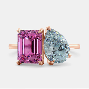 Toi et Moi ring with an emerald-cut Pink Sapphire and a pear-cut Aquamarine.