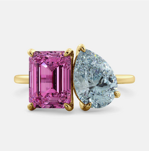 Toi et Moi ring with an emerald-cut Pink Sapphire and a pear-cut Aquamarine.
