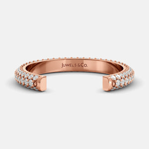 Rose gold ring with diamonds on a white background, branded 'Juwels & Co'.